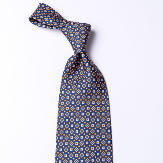 Blue tie made of pure silk with orange details.