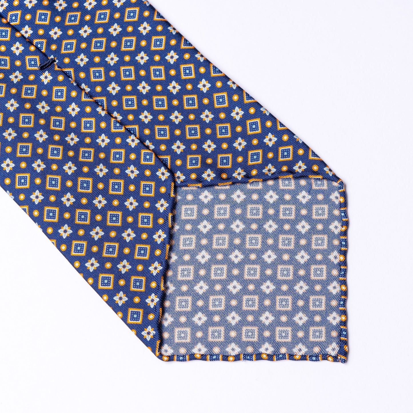 Blue tie made of pure silk with orange details.