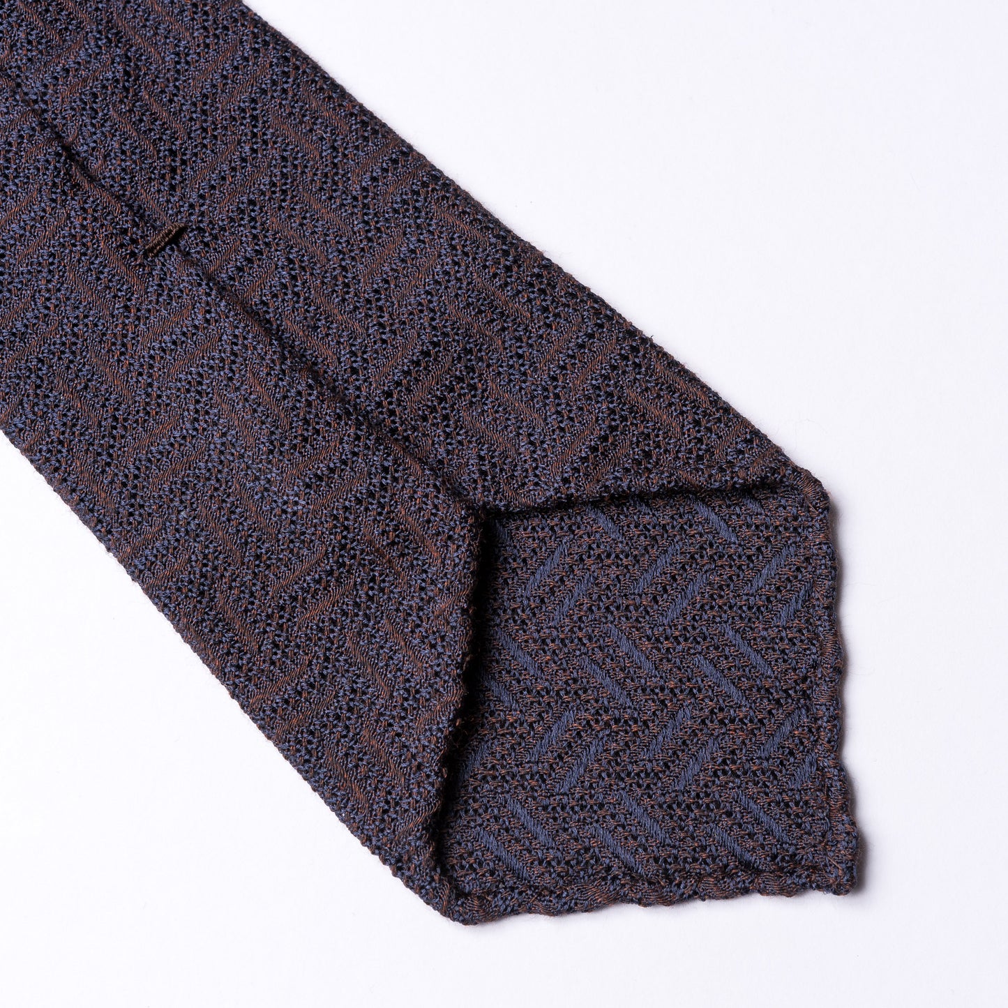 Brown tie with zig zag weave