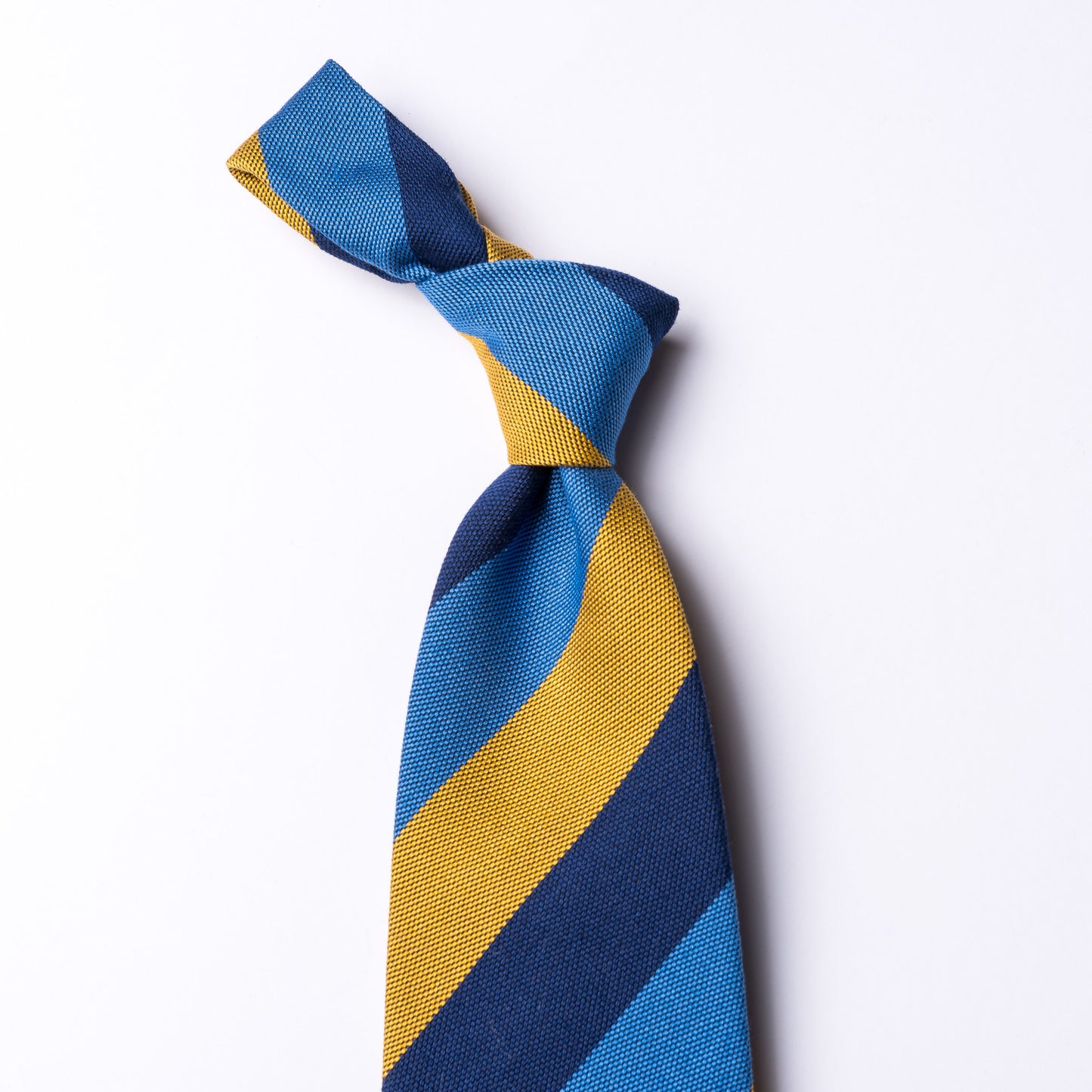 Striped tie in light blue - dark blue - yellow made of cotton and silk