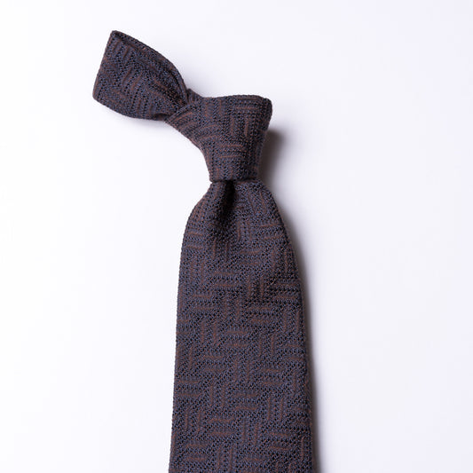 Brown tie with zig zag weave