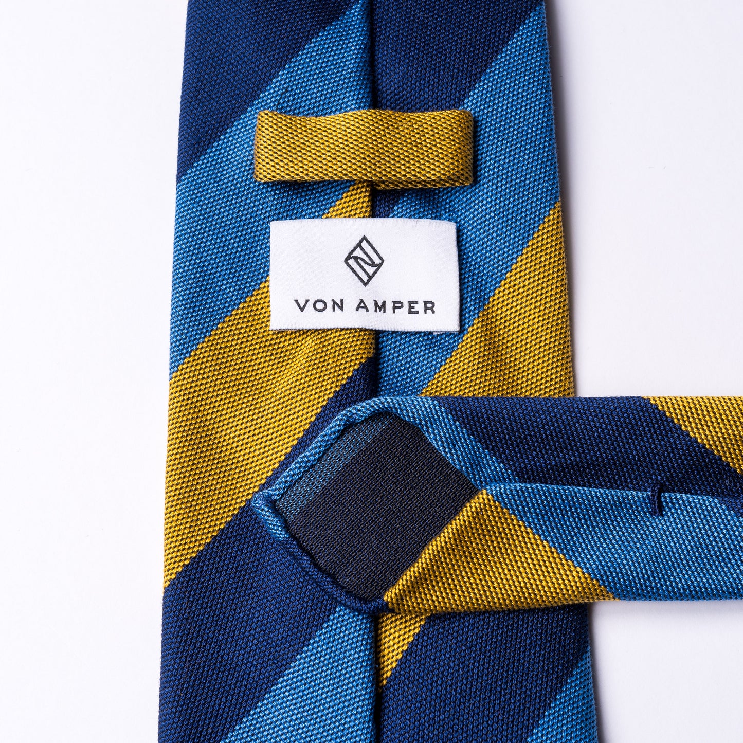 Striped tie in light blue - dark blue - yellow made of cotton and silk