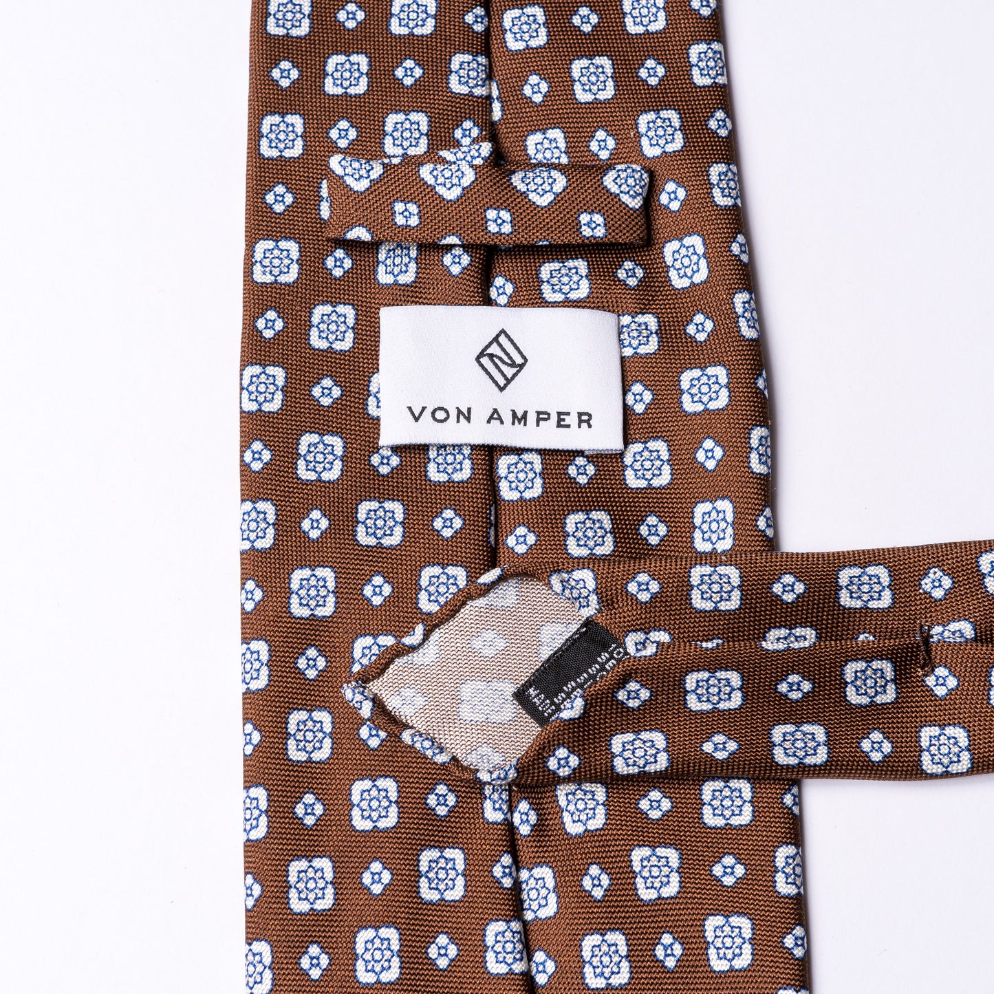 Brown tie made of pure silk with floral print