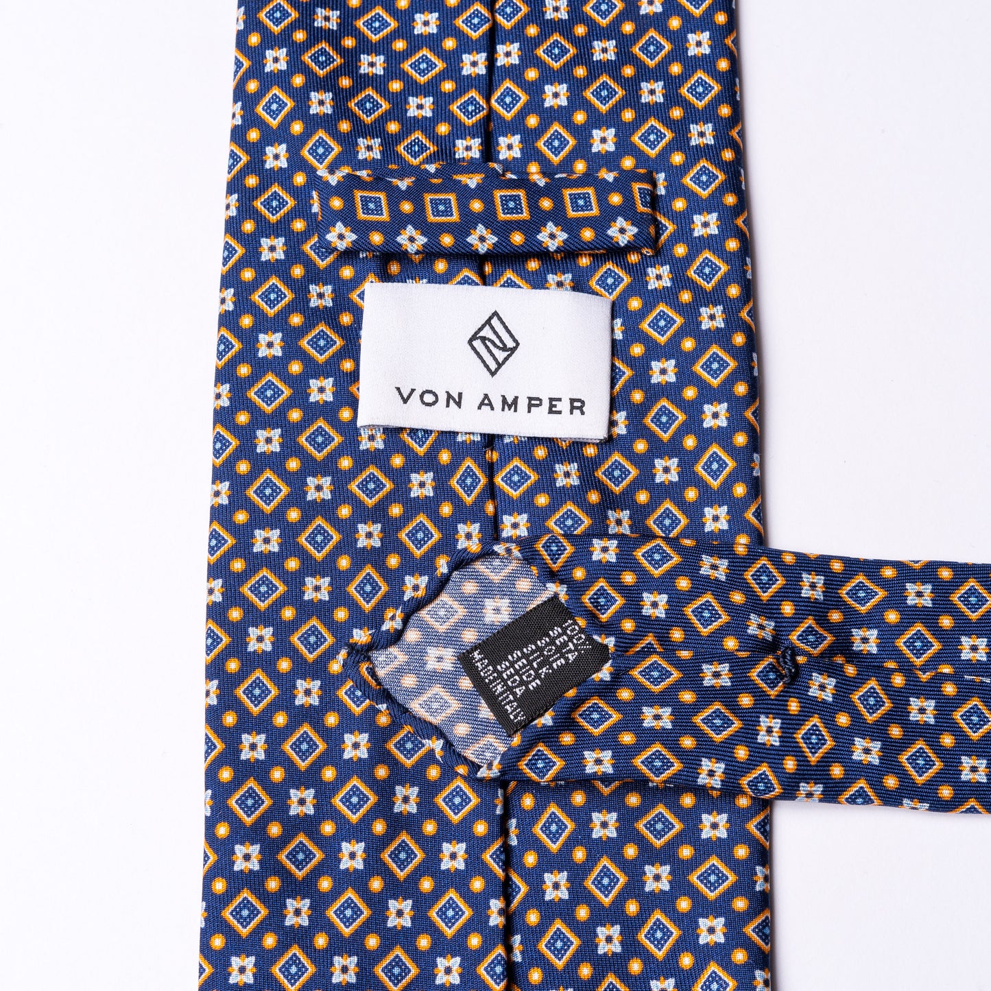 Blue tie made of pure silk with orange details.