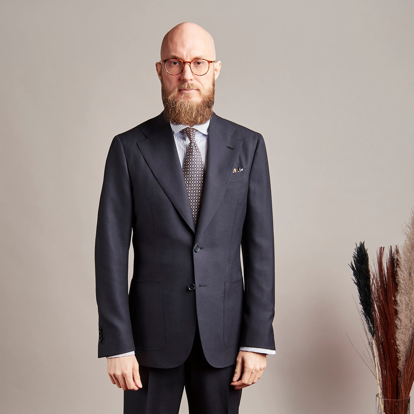 Blue tie made of pure silk with orange details.